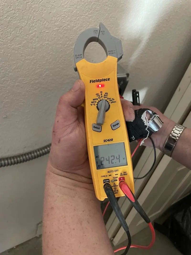 Voltage testing with clamp meter during Whole House Surge Protector in Edgewood
